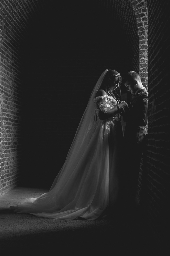 Wedding photography by Fez Photography — a silhouette against a bright window, black and white
